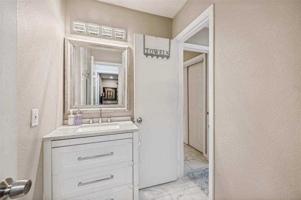 625 Caduceus Lane Hurst, TX 76053 - Photo 13 of 21 a bathroom with a sink vanity and mirror