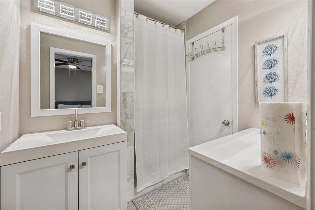625 Caduceus Lane Hurst, TX 76053 - Photo 18 of 21 a bathroom with a sink and a mirror