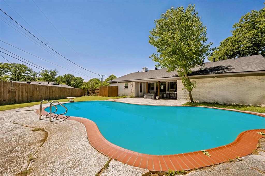625 Caduceus Lane Hurst, TX 76053 - Photo 19 of 21 a view of a swimming pool with a lounge chairs