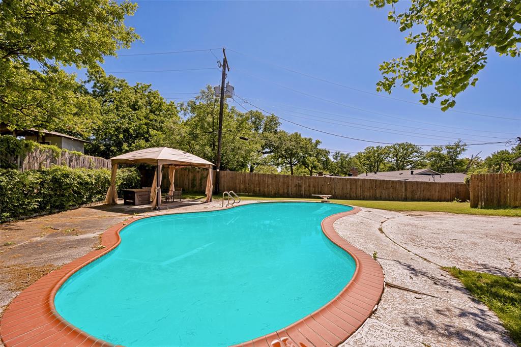 625 Caduceus Lane Hurst, TX 76053 - Photo 20 of 21 a view of a swimming pool with a patio