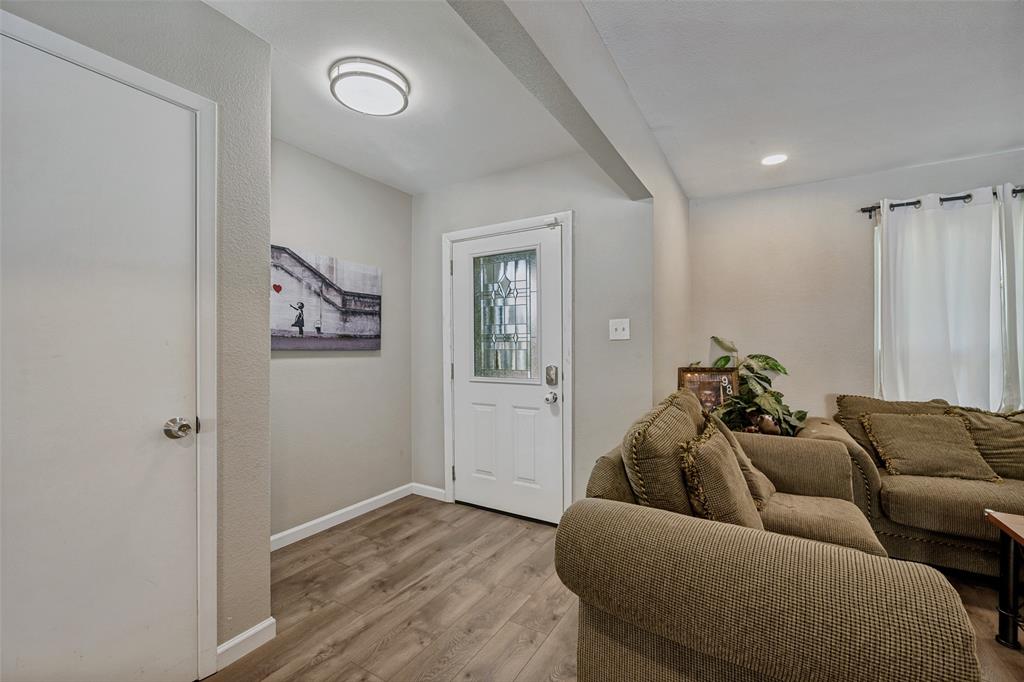 625 Caduceus Lane Hurst, TX 76053 - Photo 2 of 21 a living room with furniture and a window