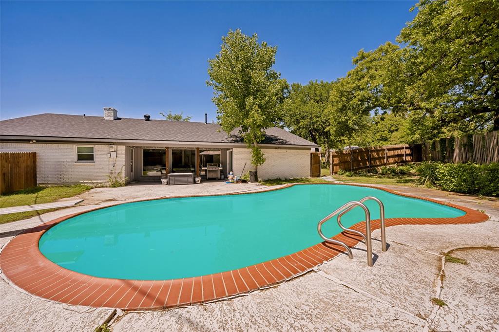 625 Caduceus Lane Hurst, TX 76053 - Photo 21 of 21 a view of a house with swimming pool and porch