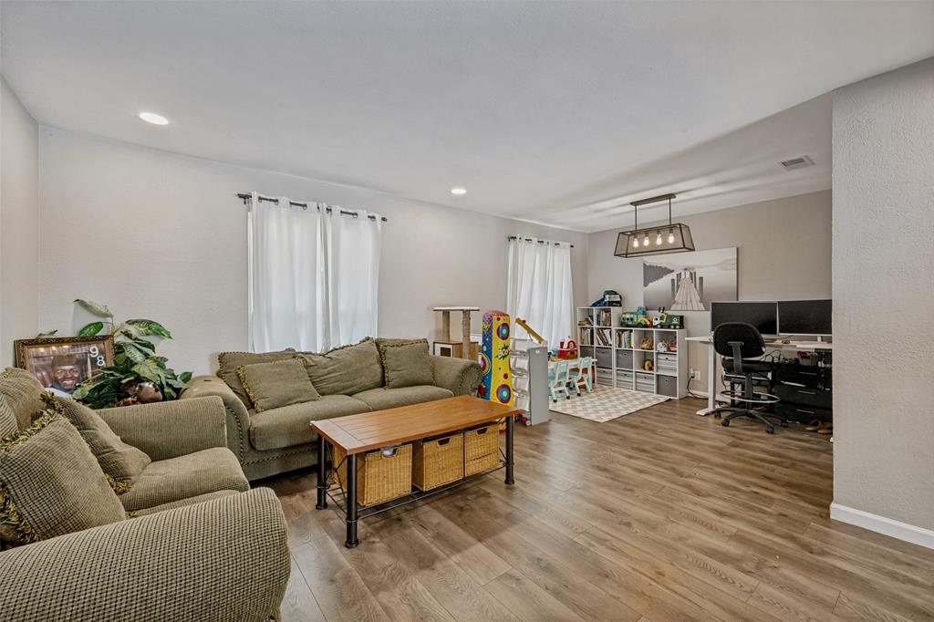 625 Caduceus Lane Hurst, TX 76053 - Photo 4 of 21 a living room with furniture and a wooden floor