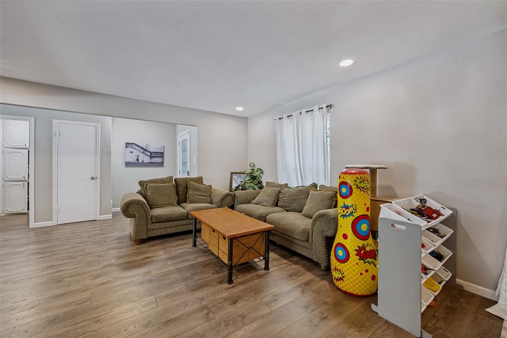 625 Caduceus Lane Hurst, TX 76053 - Photo 5 of 21 a living room with furniture and a wooden floor