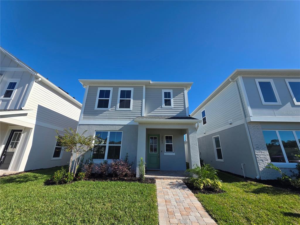 2047 Iorio Street St. Cloud, FL 34771 - Photo 1 of 17 a front view of house with yard and green space