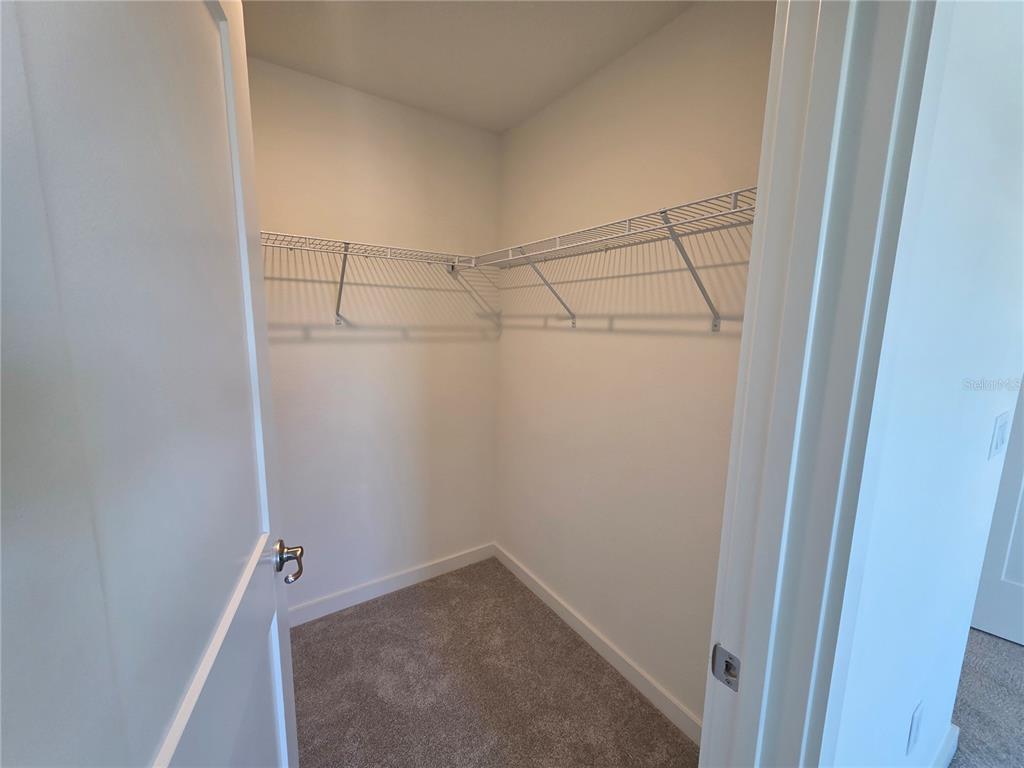 2047 Iorio Street St. Cloud, FL 34771 - Photo 12 of 17 a view of a room with empty racks