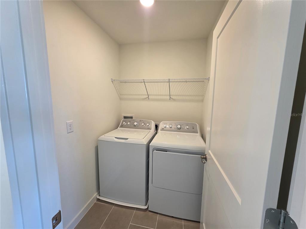 2047 Iorio Street St. Cloud, FL 34771 - Photo 17 of 17 a utility room with dryer and washer