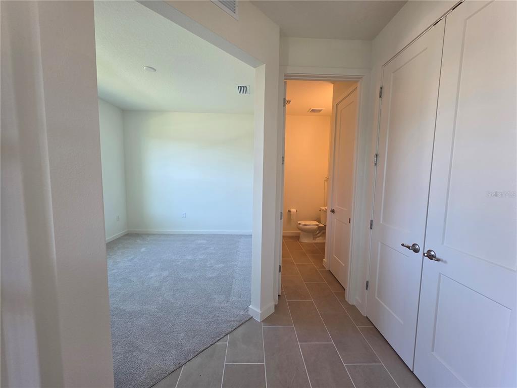 2047 Iorio Street St. Cloud, FL 34771 - Photo 6 of 17 a view of a bathroom from a hallway