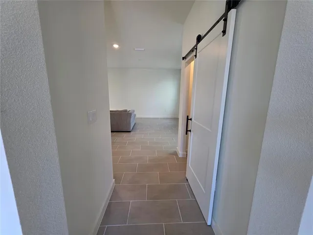 a bathroom with a glass door shower and a sink