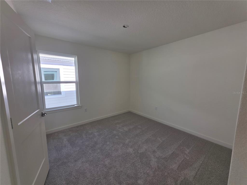 2047 Iorio Street St. Cloud, FL 34771 - Photo 10 of 17 a room that has a window in it