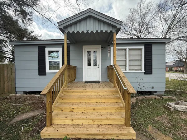 a view of a house with more wooden stairs