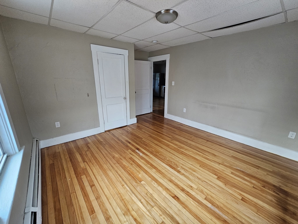 333 Oak Hill Road, Unit 2R Fitchburg, MA 01420 - Photo 5 of 12 a view of an empty room with wooden floor