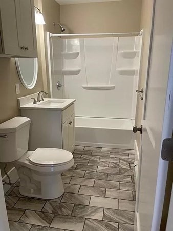 333 Oak Hill Road, Unit 2R Fitchburg, MA 01420 - Photo 9 of 12 a bathroom with a sink toilet and shower