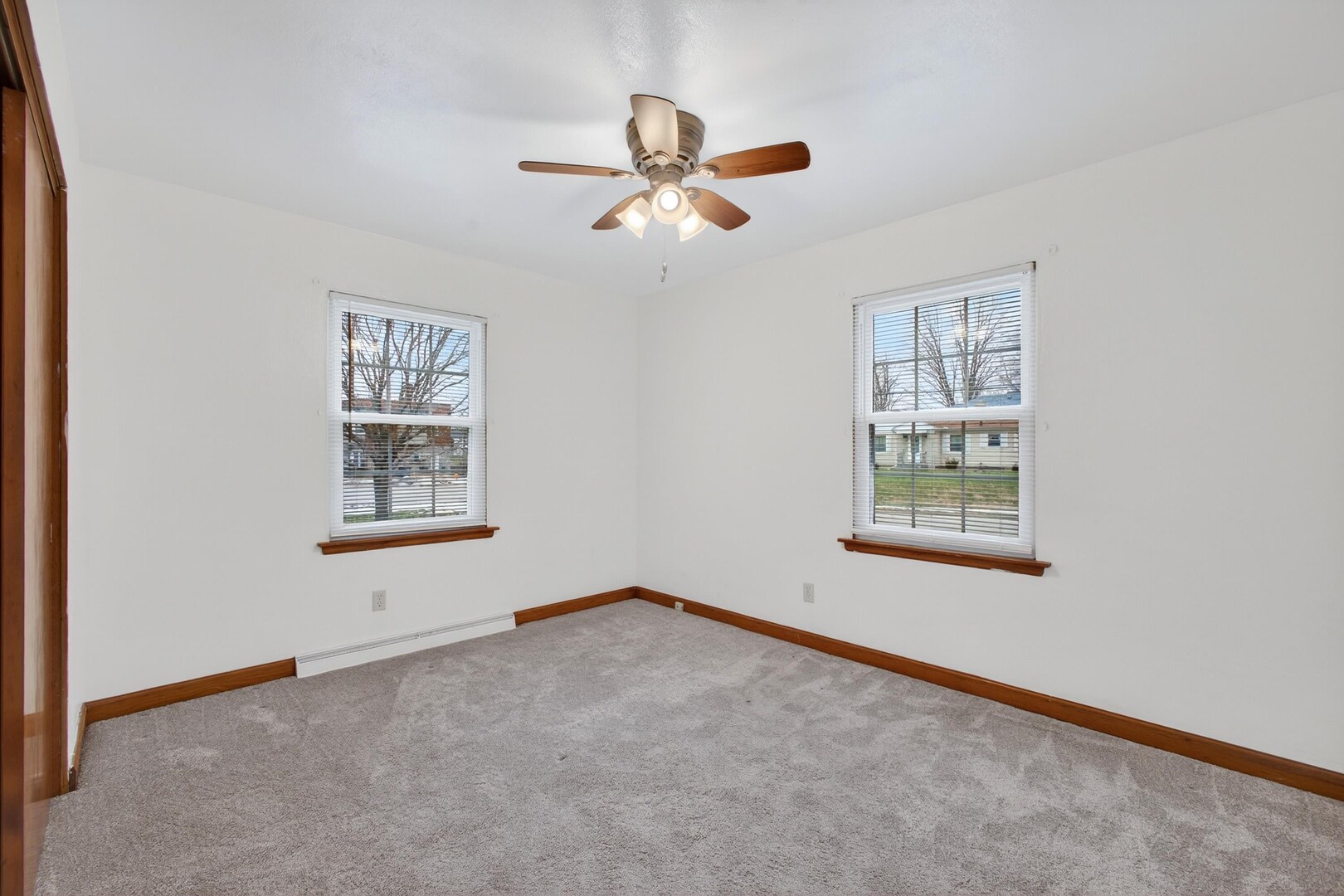 502-504 48th Street Moline, IL 61265 - Photo 13 of 31 a view of empty room with window and ceiling fan