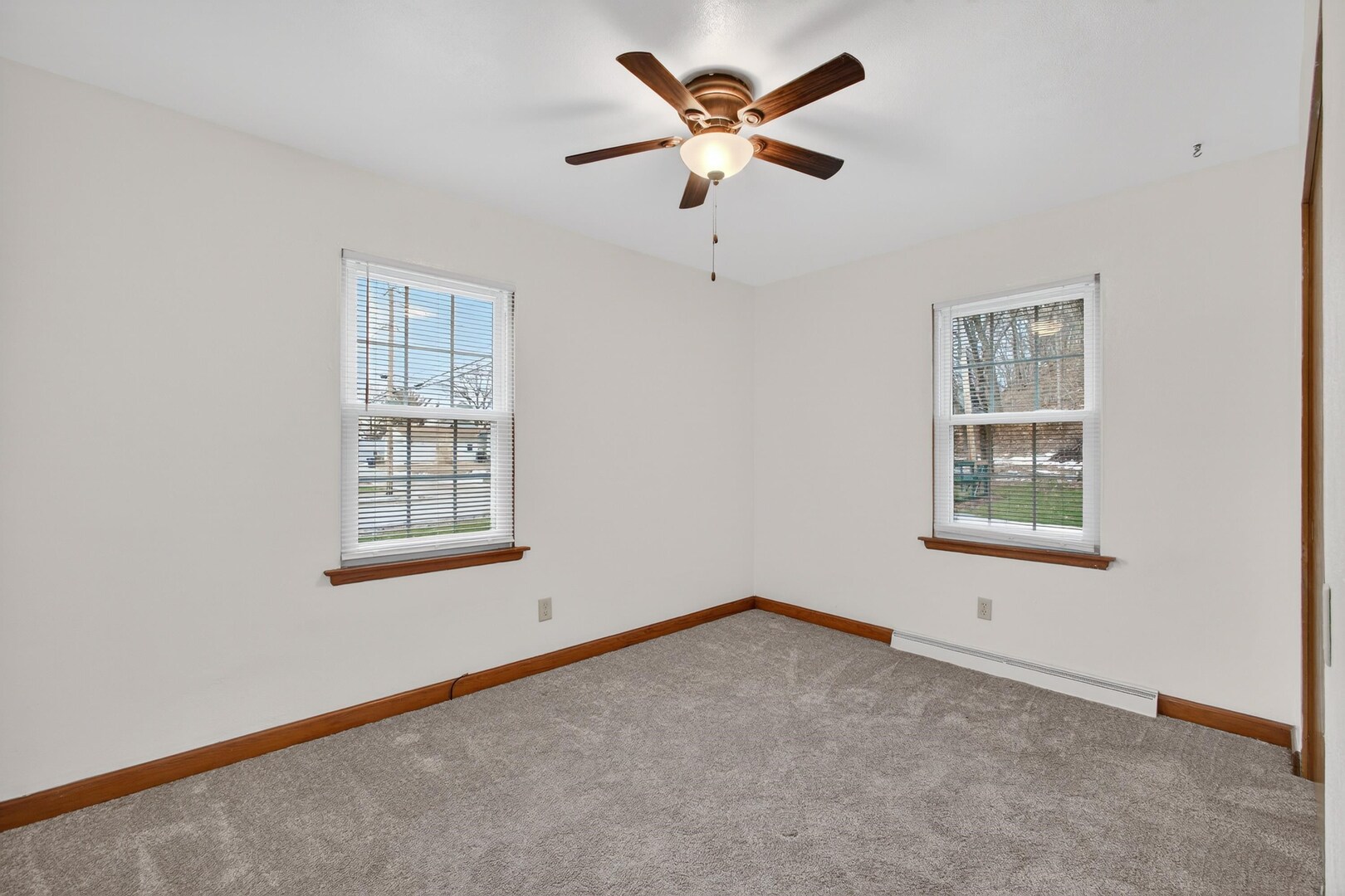 502-504 48th Street Moline, IL 61265 - Photo 15 of 31 an empty room with a window and a fan
