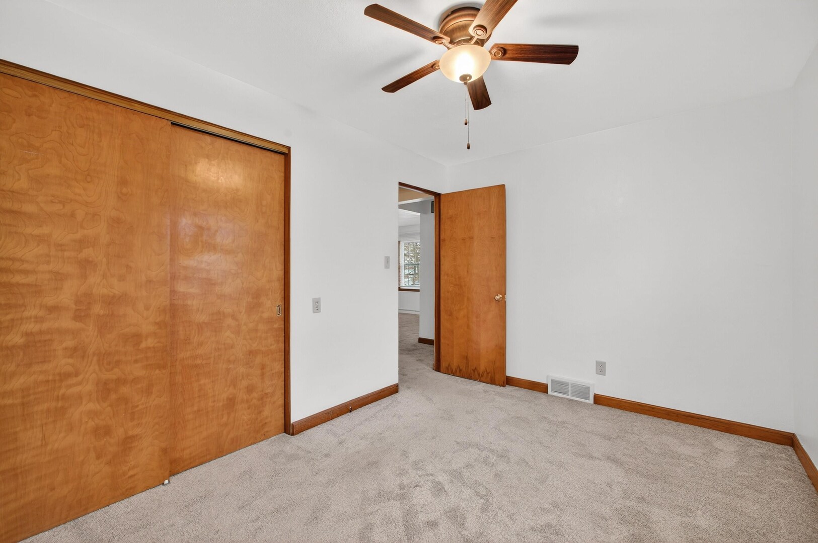 502-504 48th Street Moline, IL 61265 - Photo 17 of 31 an empty room with closet and a chandelier fan