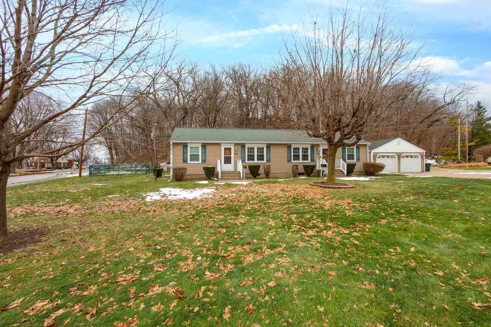 502-504 48th Street Moline, IL 61265 - Photo 2 of 31 a house with trees in front of it