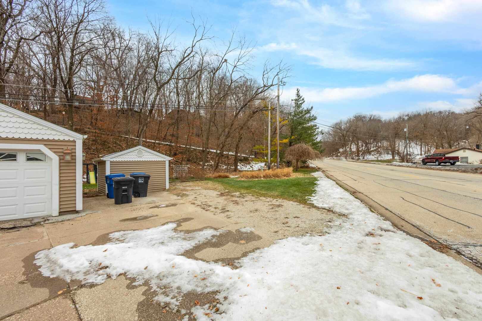 502-504 48th Street Moline, IL 61265 - Photo 4 of 31 a view of a house with a yard covered in snow