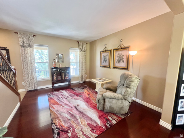 369 Culross Circle Tooele, UT 84074 - Photo 5 of 54 Spacious living area featuring rich wood-finish flooring, ample natural light from multiple windows, and neutral wall tones