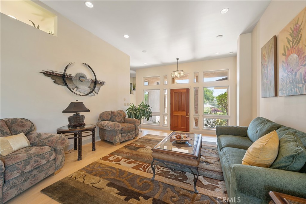 149 Andre Drive Arroyo Grande, CA 93420 - Photo 11 of 67 a living room with furniture a rug and a chandelier