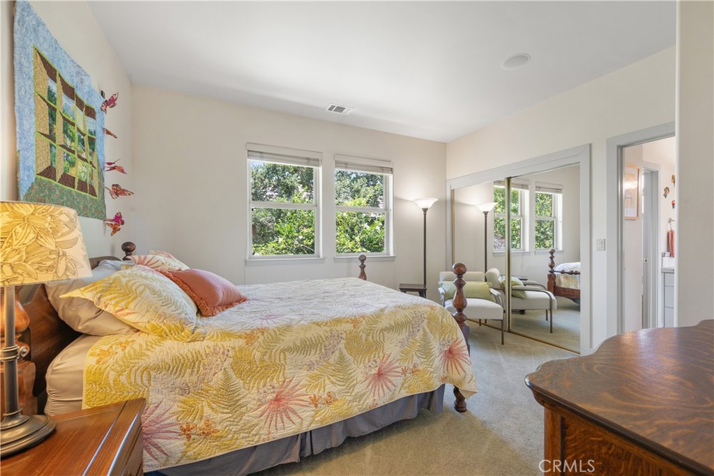 149 Andre Drive Arroyo Grande, CA 93420 - Photo 25 of 67 a bedroom with a bed and wooden floor