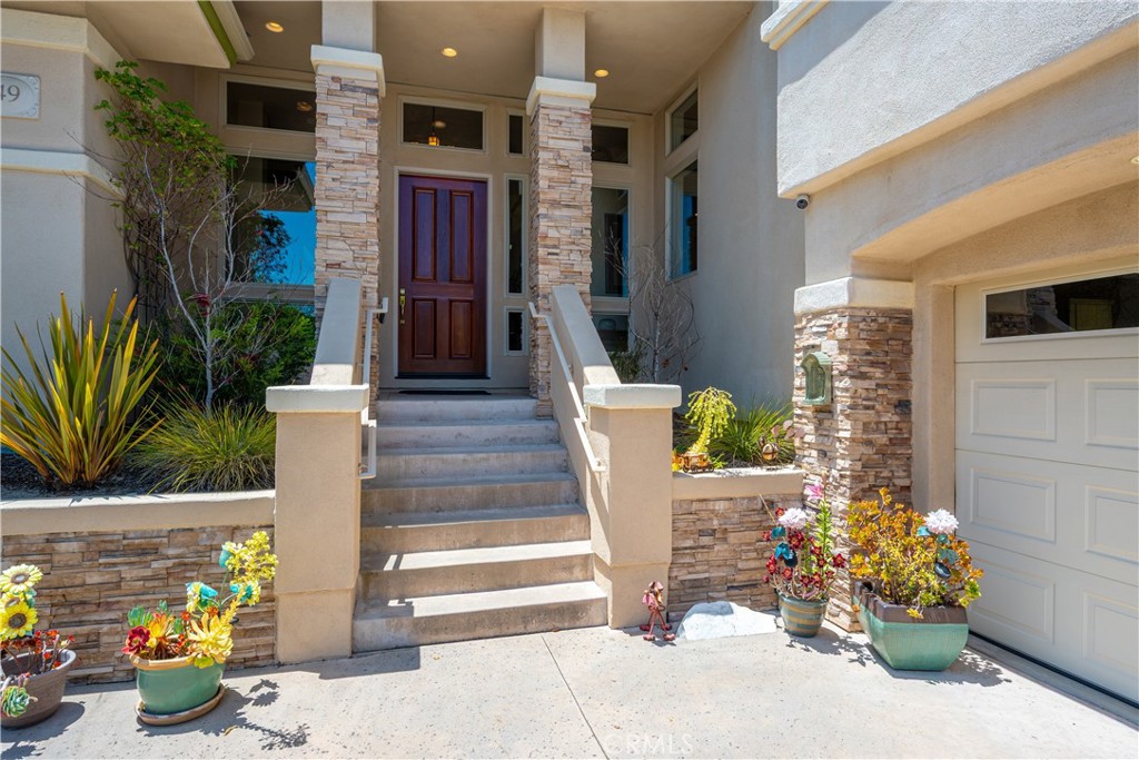 149 Andre Drive Arroyo Grande, CA 93420 - Photo 6 of 67 a front view of a house with outdoor seating and plants