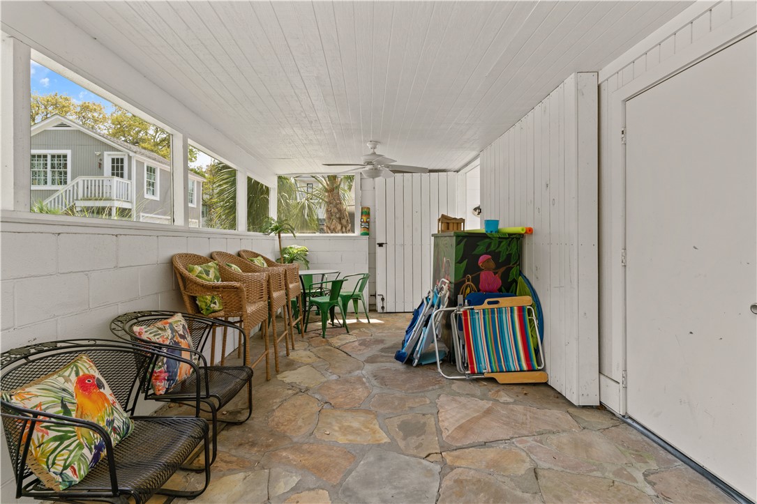 4210 7th Street St. Simons Island, GA 31522 - Photo 28 of 44 Screen porch between houses