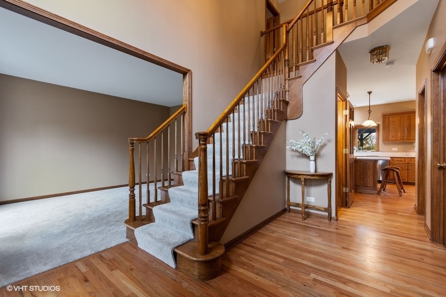 517 Ekman Drive Batavia, IL 60510 - Photo 2 of 22 a view of entryway and hall with wooden floor