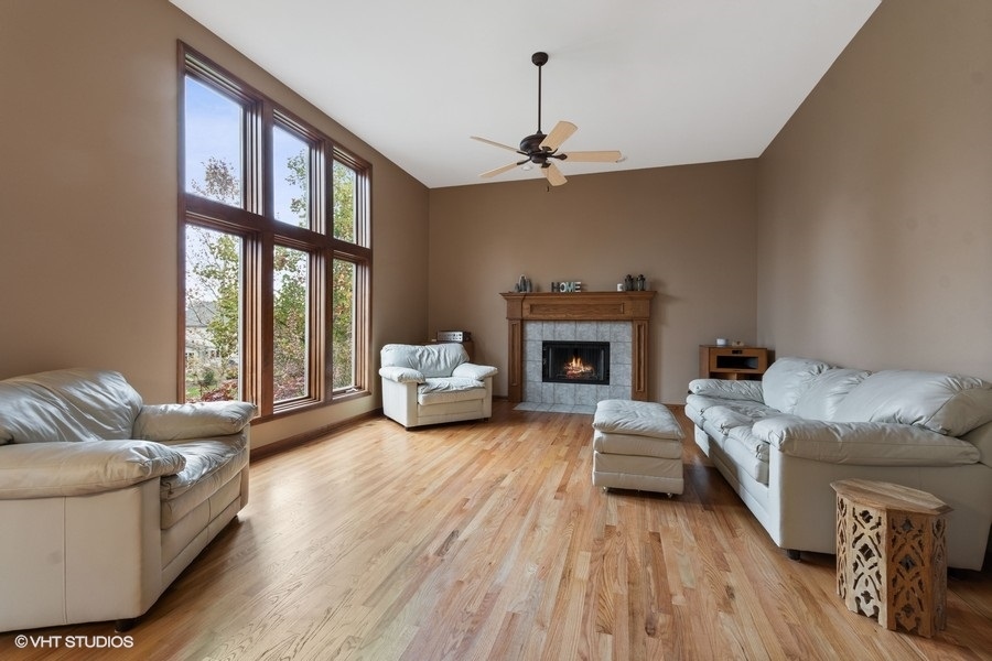 517 Ekman Drive Batavia, IL 60510 - Photo 7 of 22 a living room with furniture and a fireplace