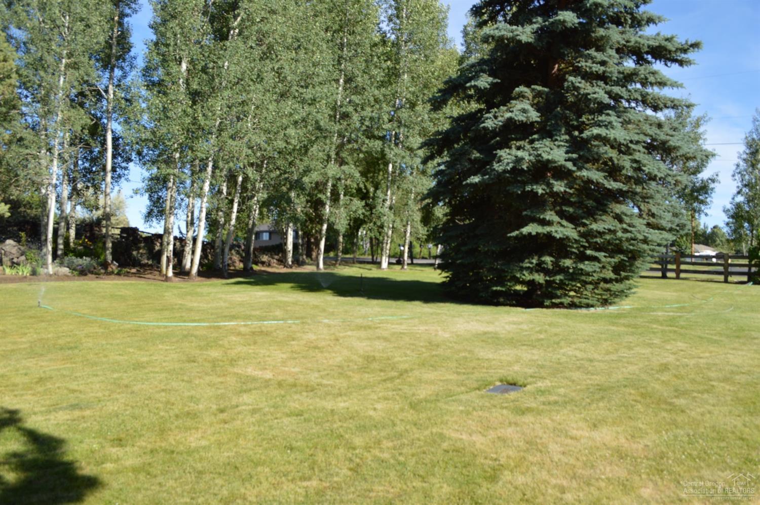 61835 Dobbin Road Bend, OR 97702 - Photo 17 of 23 a view of swimming pool with trees