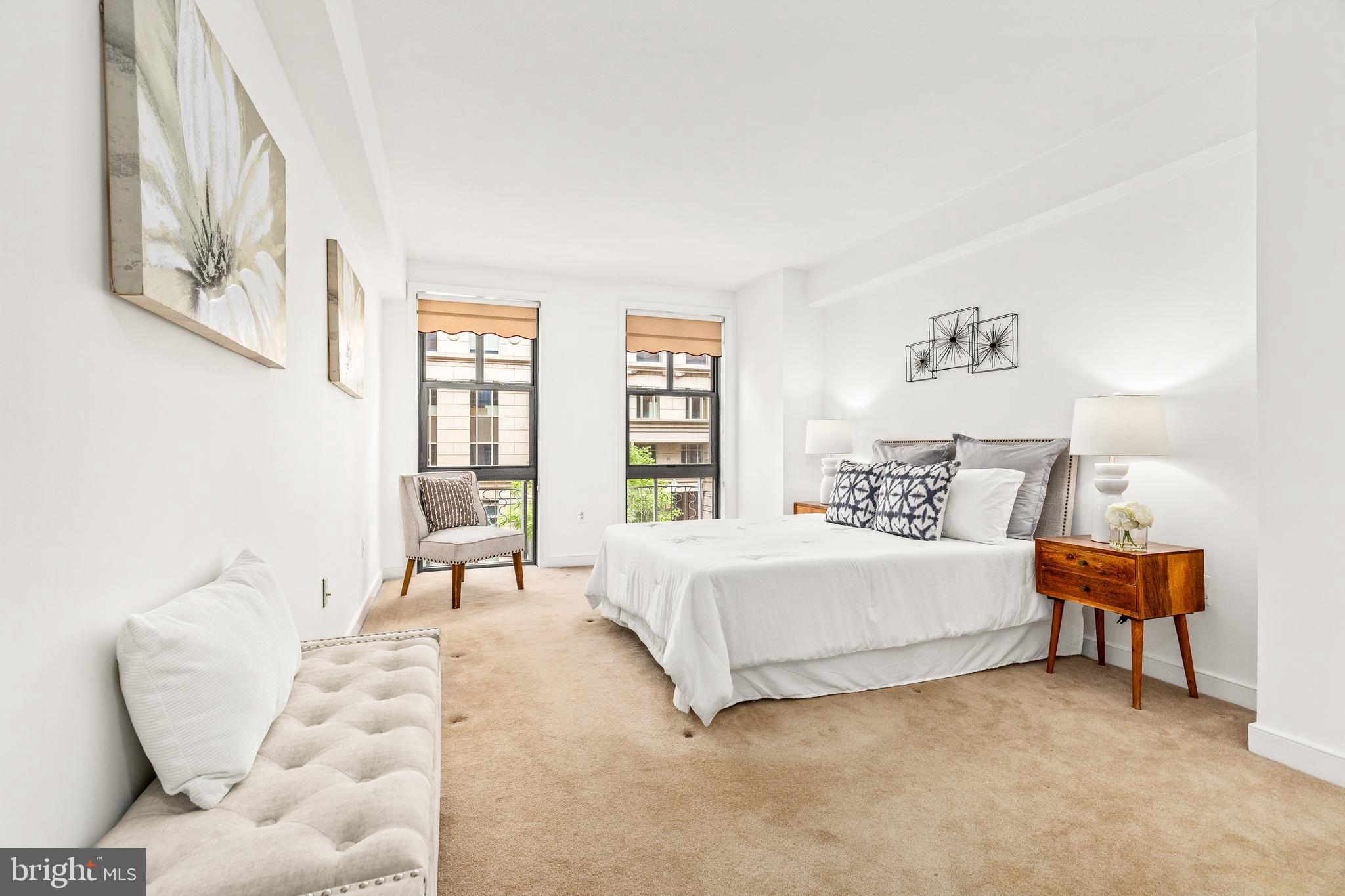 616 E Street Northwest, Unit 322 Washington, DC 20004 - Photo 14 of 33 a bedroom with a bed and a couch