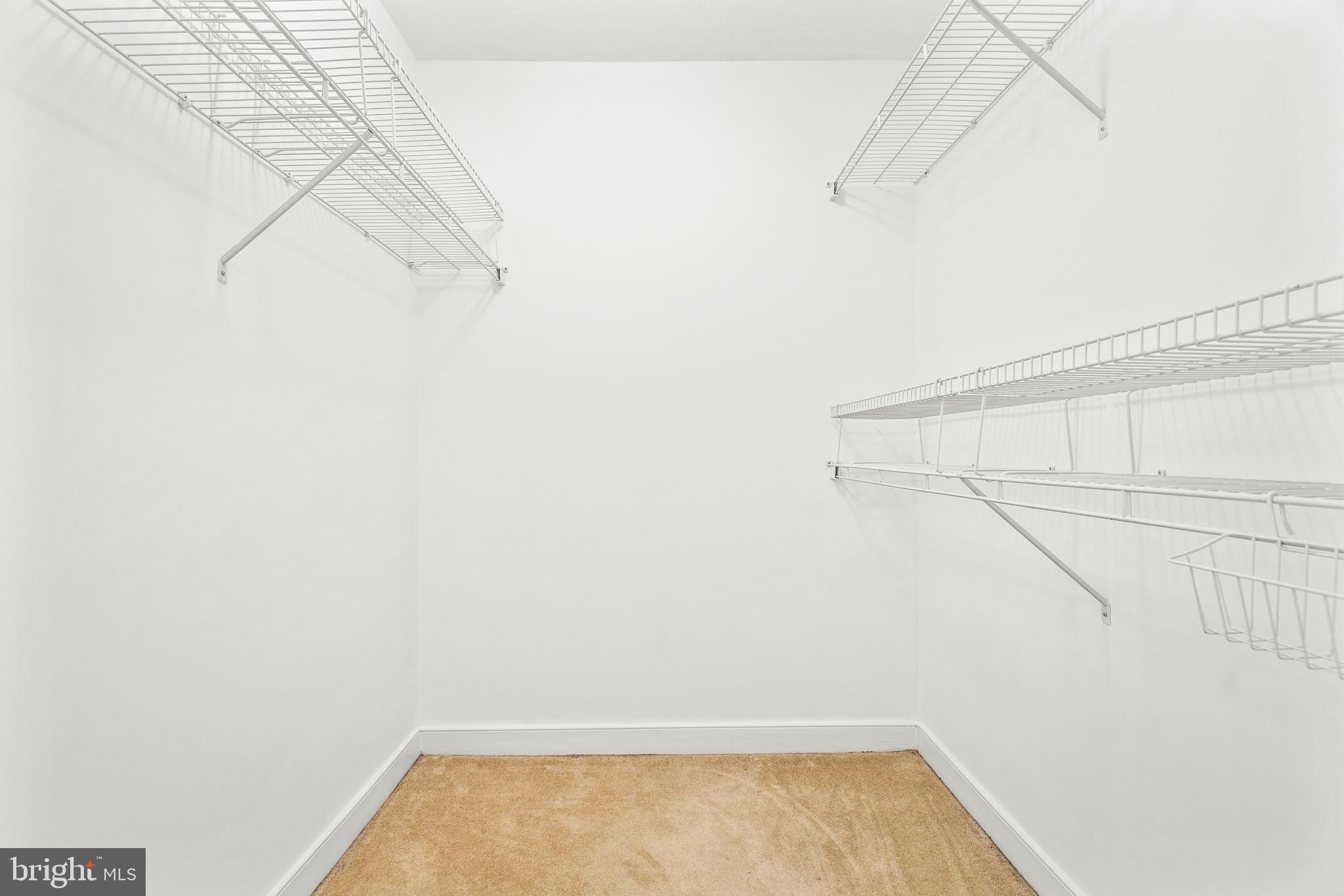 616 E Street Northwest, Unit 322 Washington, DC 20004 - Photo 17 of 33 a view of a room with racks on the wall