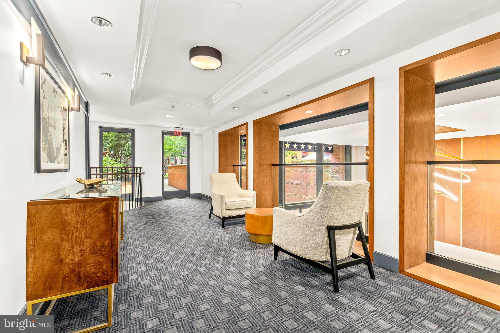 616 E Street Northwest, Unit 322 Washington, DC 20004 - Photo 25 of 33 a living room with furniture and a floor to ceiling window