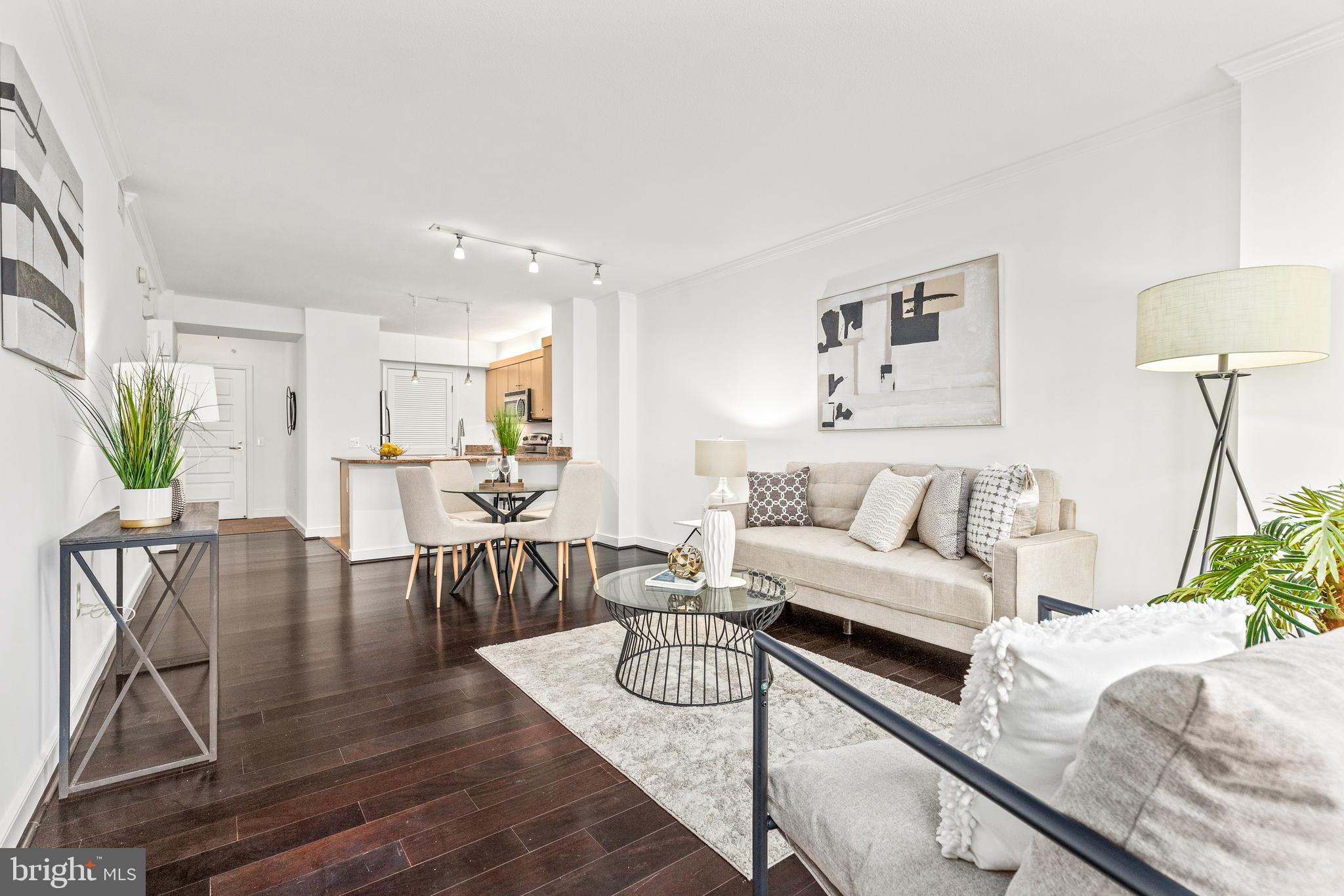 616 E Street Northwest, Unit 322 Washington, DC 20004 - Photo 5 of 33 a living room with furniture and a table