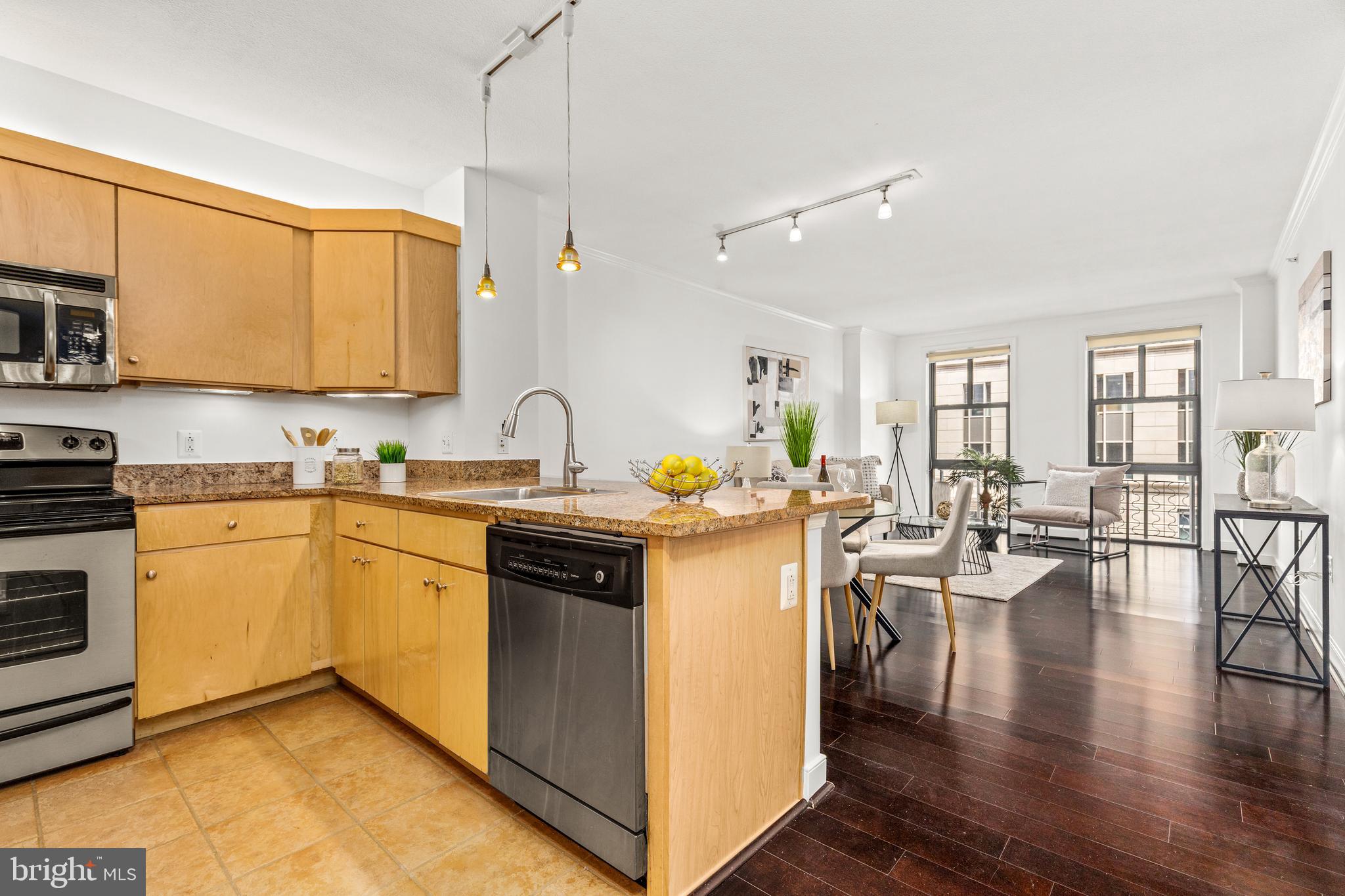 616 E Street Northwest, Unit 322 Washington, DC 20004 - Photo 7 of 33 a kitchen with a sink stove and cabinets