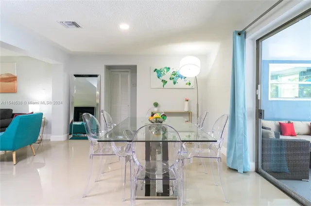 a view of living room with furniture and flowers