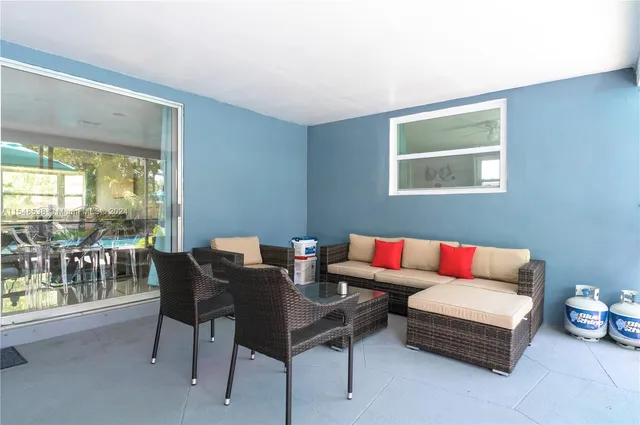 a living room with furniture and a table