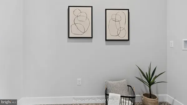 a view of a hallway with paintings on the wall
