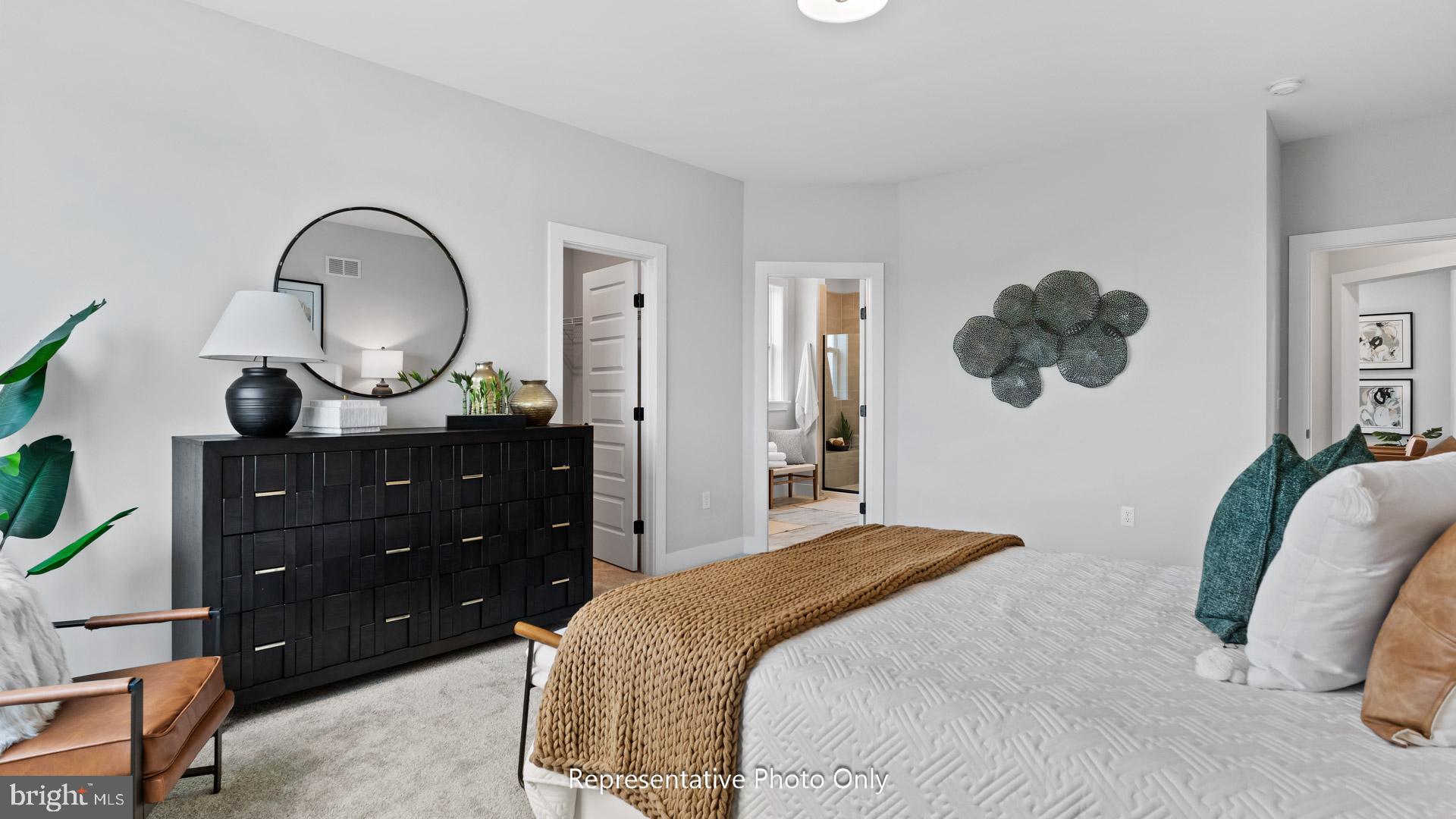 110 Copper Ridge Drive Newmanstown, PA 17073 - Photo 23 of 43 a bedroom with a bed and a chandelier