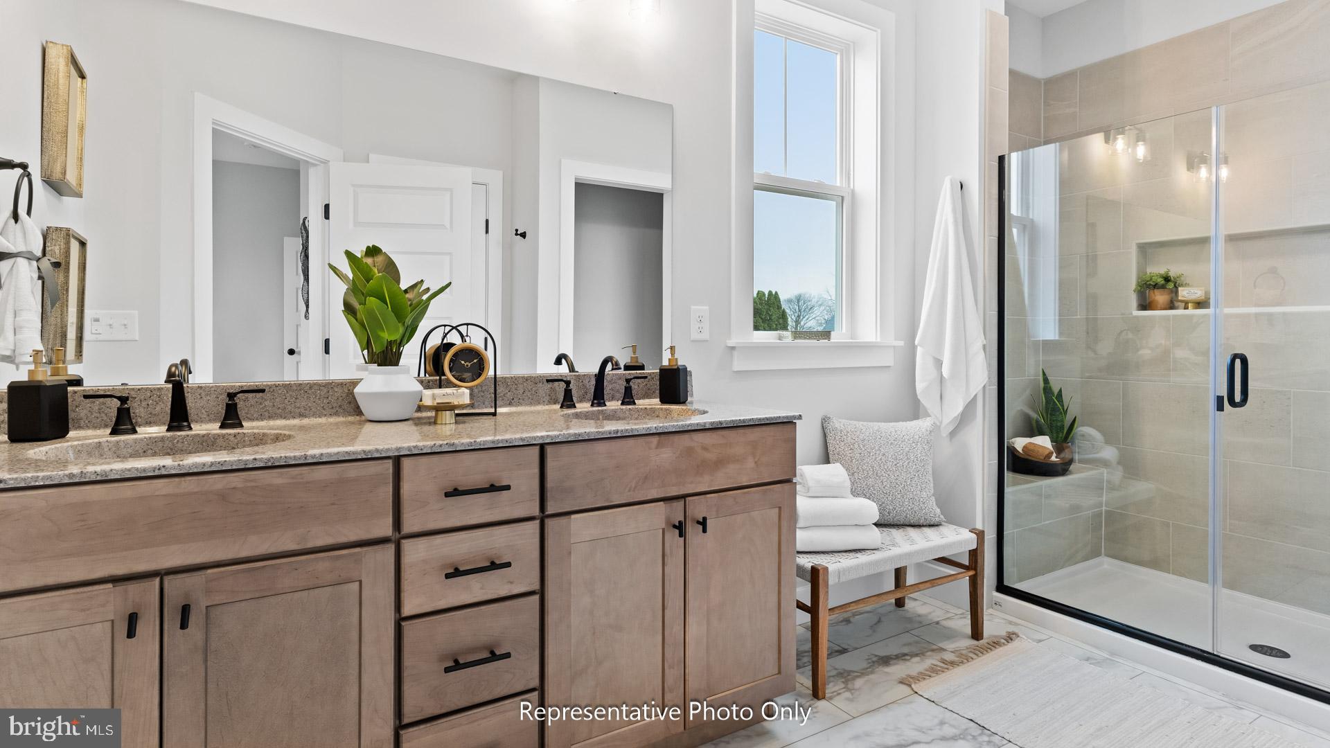 110 Copper Ridge Drive Newmanstown, PA 17073 - Photo 25 of 43 a bathroom with a sink a mirror and a shower