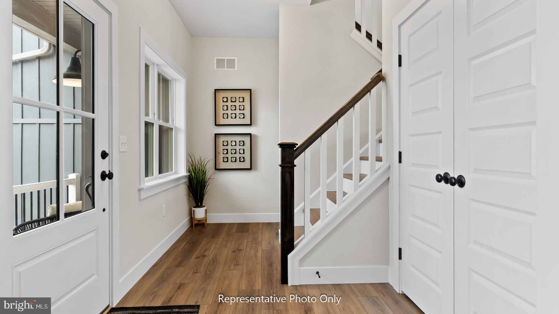 110 Copper Ridge Drive Newmanstown, PA 17073 - Photo 4 of 43 a view of a hallway with wooden floor and staircase