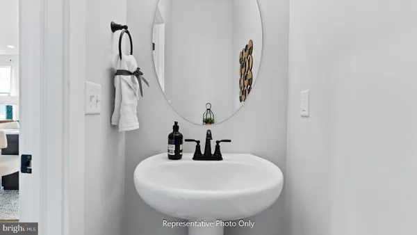 a bathroom with a sink and mirror