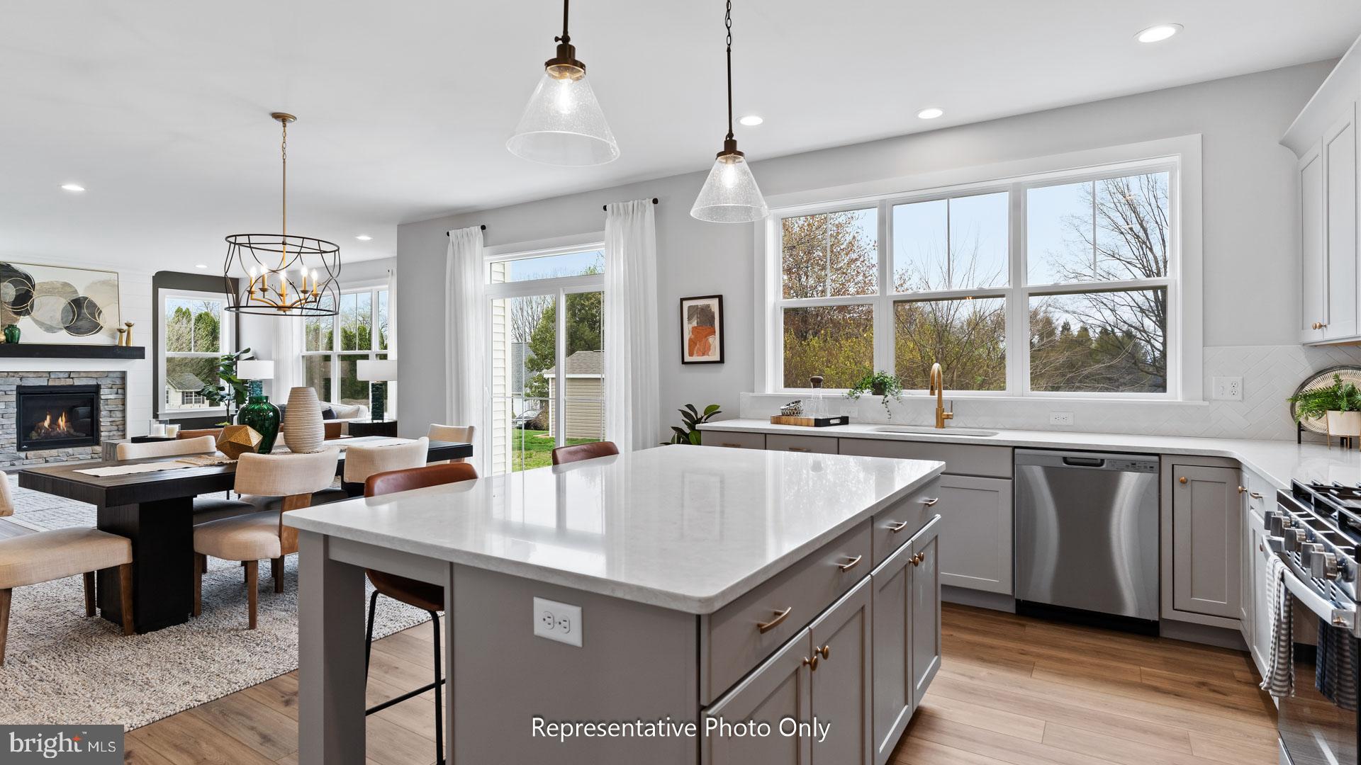 110 Copper Ridge Drive Newmanstown, PA 17073 - Photo 10 of 43 a kitchen with a stove a sink a center island and furniture
