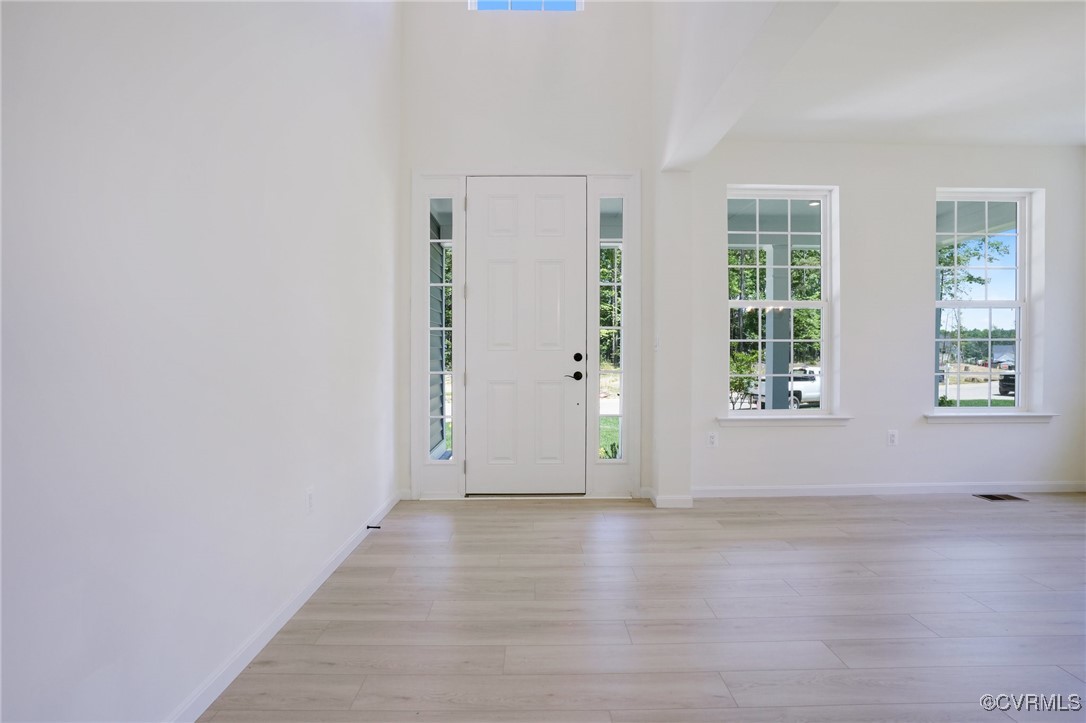 15413 Millwright Road Chesterfield, VA 23832 - Photo 9 of 50 an empty room with wooden floor and windows