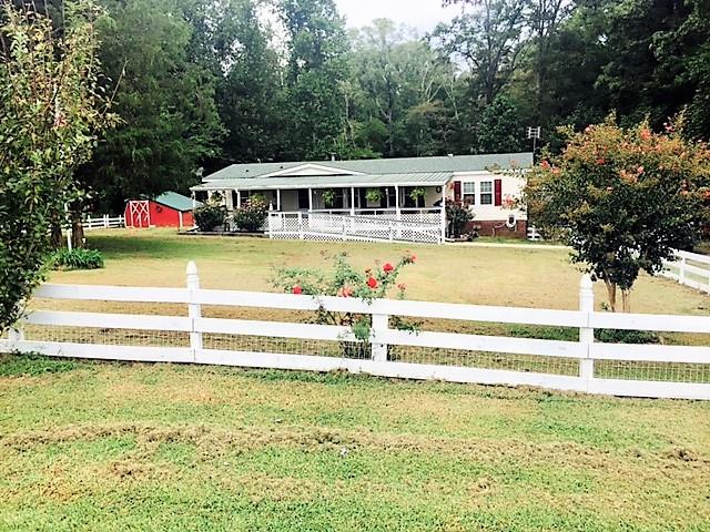 48 L Mitchell Road Kelso, TN 37348 - Photo 1 of 27 a view of a house with a swimming pool