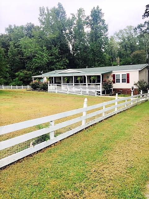48 L Mitchell Road Kelso, TN 37348 - Photo 2 of 27 a front view of a house with swimming pool