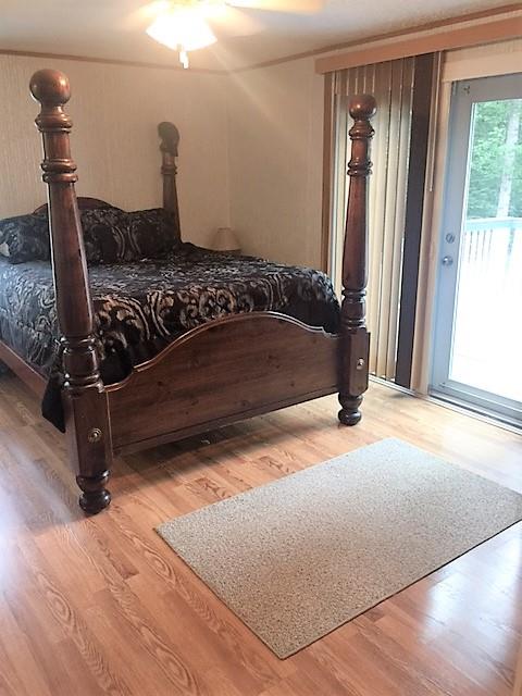 48 L Mitchell Road Kelso, TN 37348 - Photo 22 of 27 a bedroom with a bed and a window
