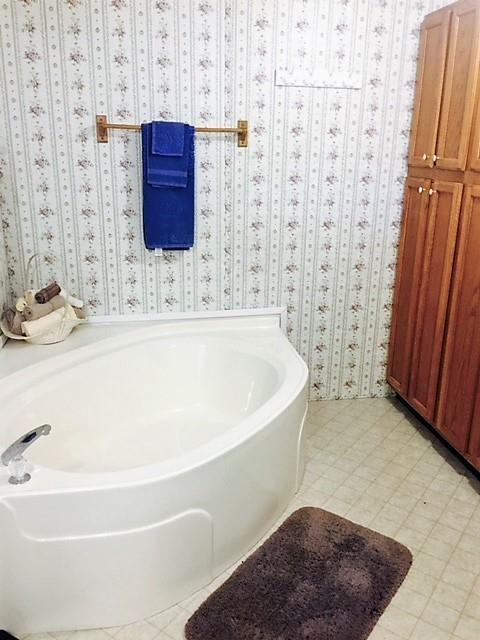 48 L Mitchell Road Kelso, TN 37348 - Photo 23 of 27 a bathroom with a bathtub and shower