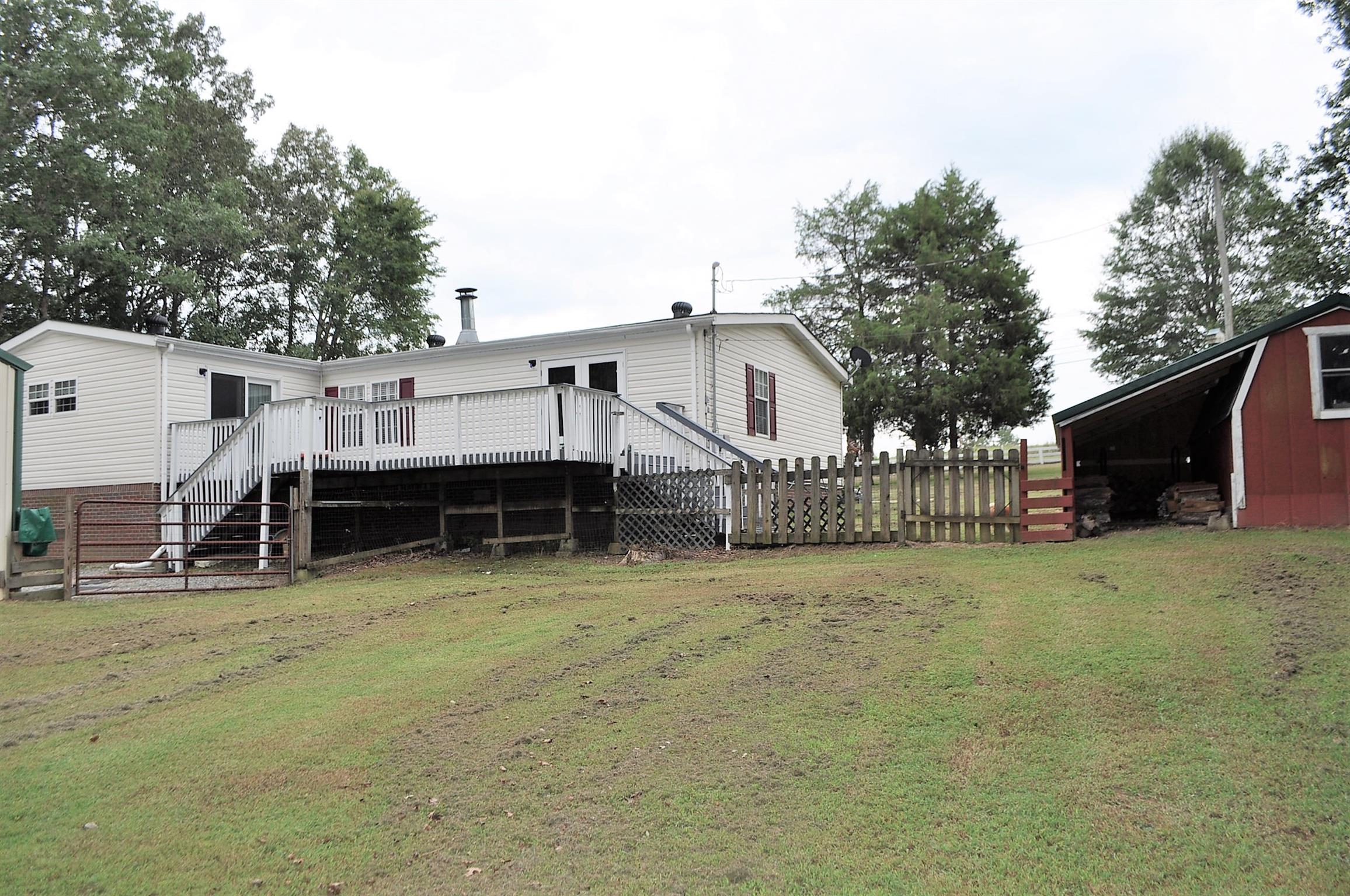 48 L Mitchell Road Kelso, TN 37348 - Photo 4 of 27 a view of a house with a backyard and a tree