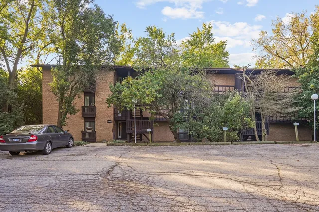 a view of a car parked in front of a building
